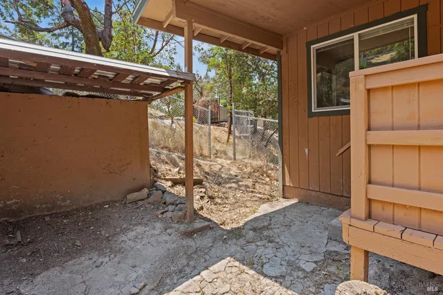 a view of a balcony with wooden floor