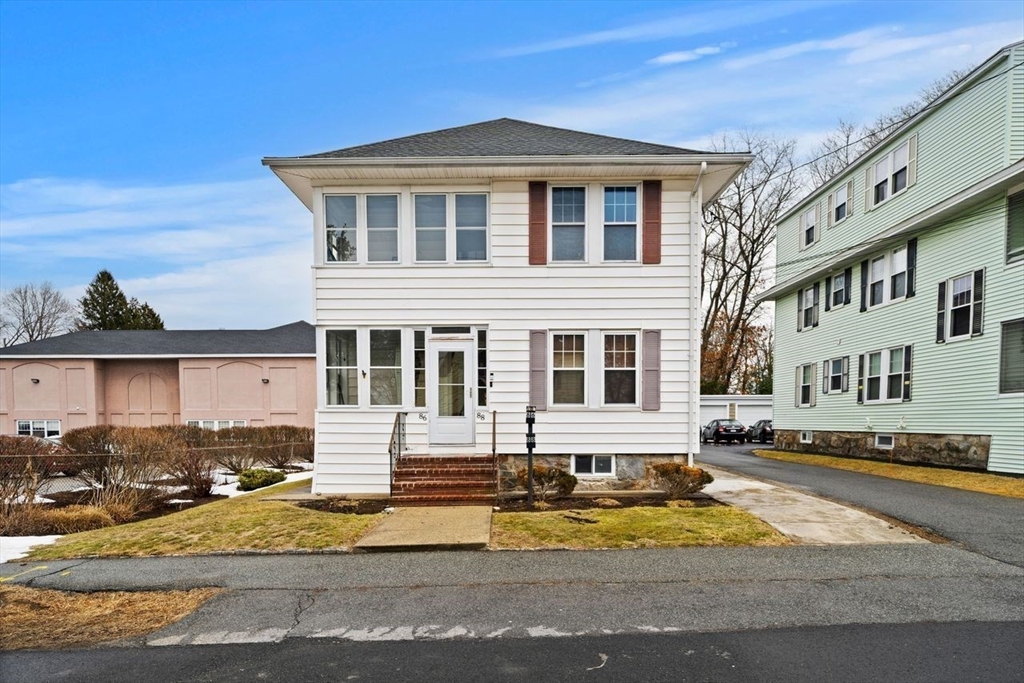 86-88 Maple Avenue North Andover, MA 01845 - Photo 1 of 41 a front view of a house with a yard