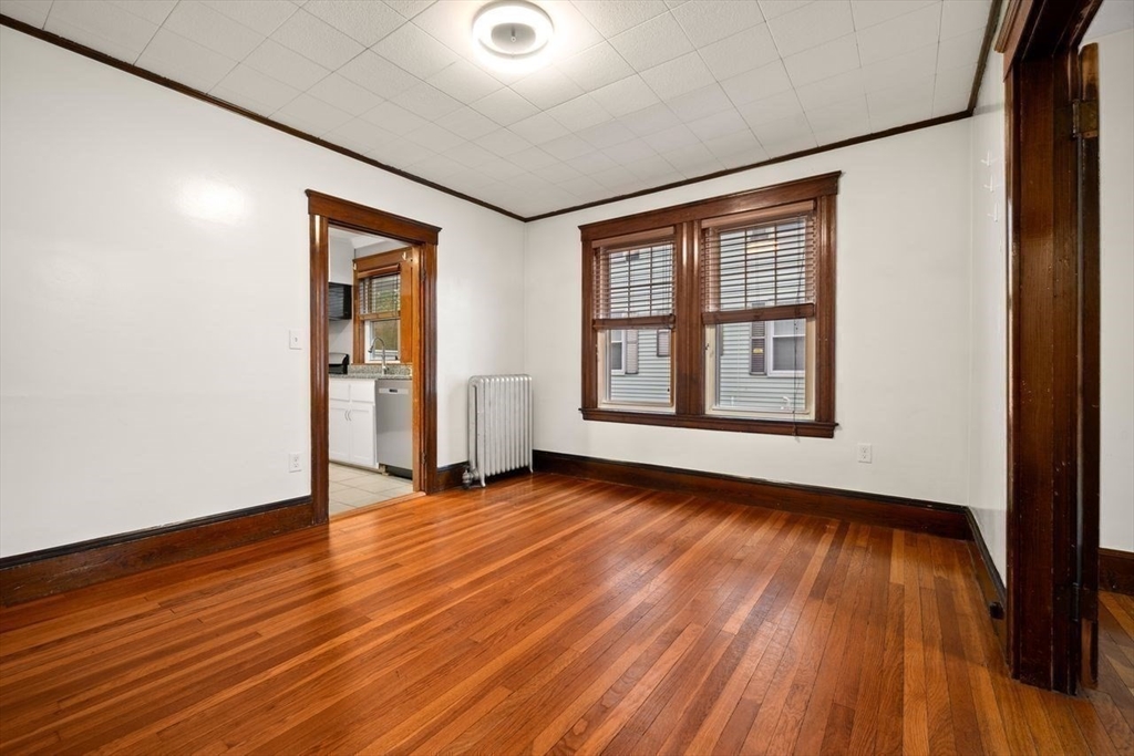 86-88 Maple Avenue North Andover, MA 01845 - Photo 14 of 41 a view of an empty room with wooden floor and a window