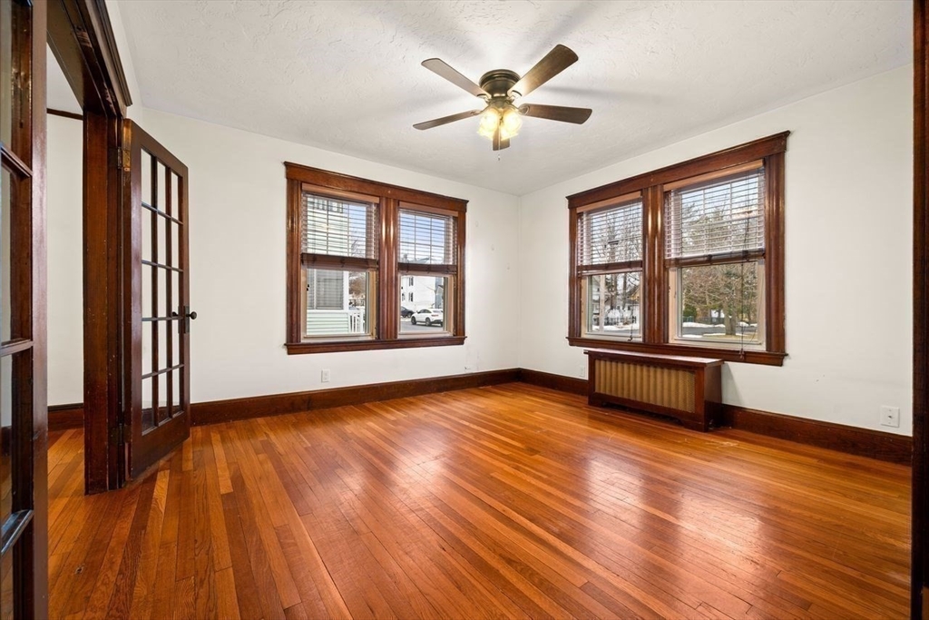 86-88 Maple Avenue North Andover, MA 01845 - Photo 15 of 41 a view of an empty room with wooden floor and a window