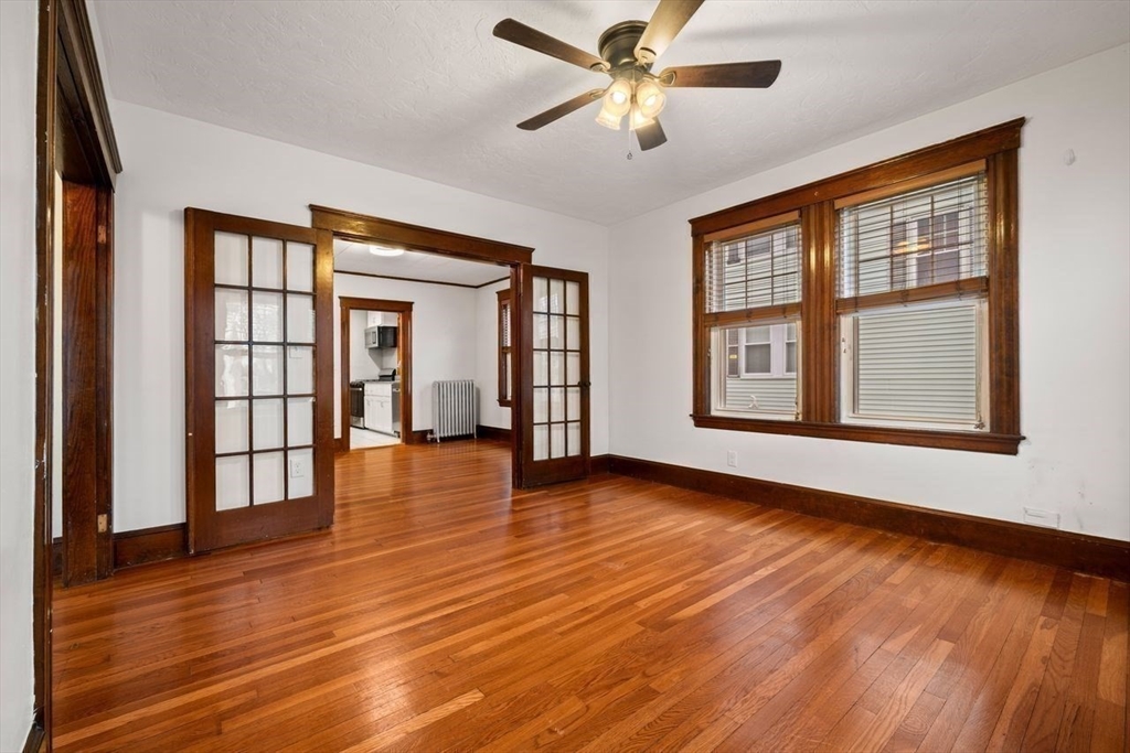 86-88 Maple Avenue North Andover, MA 01845 - Photo 16 of 41 a view of an empty room with wooden floor and a window