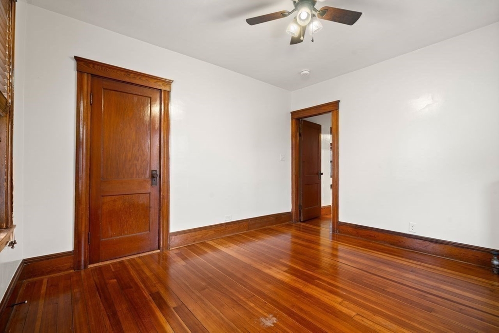 86-88 Maple Avenue North Andover, MA 01845 - Photo 18 of 41 wooden floor in an empty room with a window