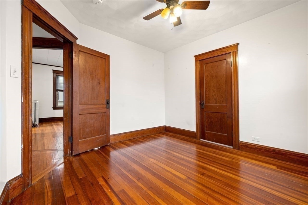86-88 Maple Avenue North Andover, MA 01845 - Photo 19 of 41 an empty room with wooden floor closet and windows