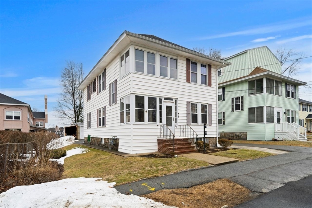 86-88 Maple Avenue North Andover, MA 01845 - Photo 2 of 41 a front view of a house with a yard
