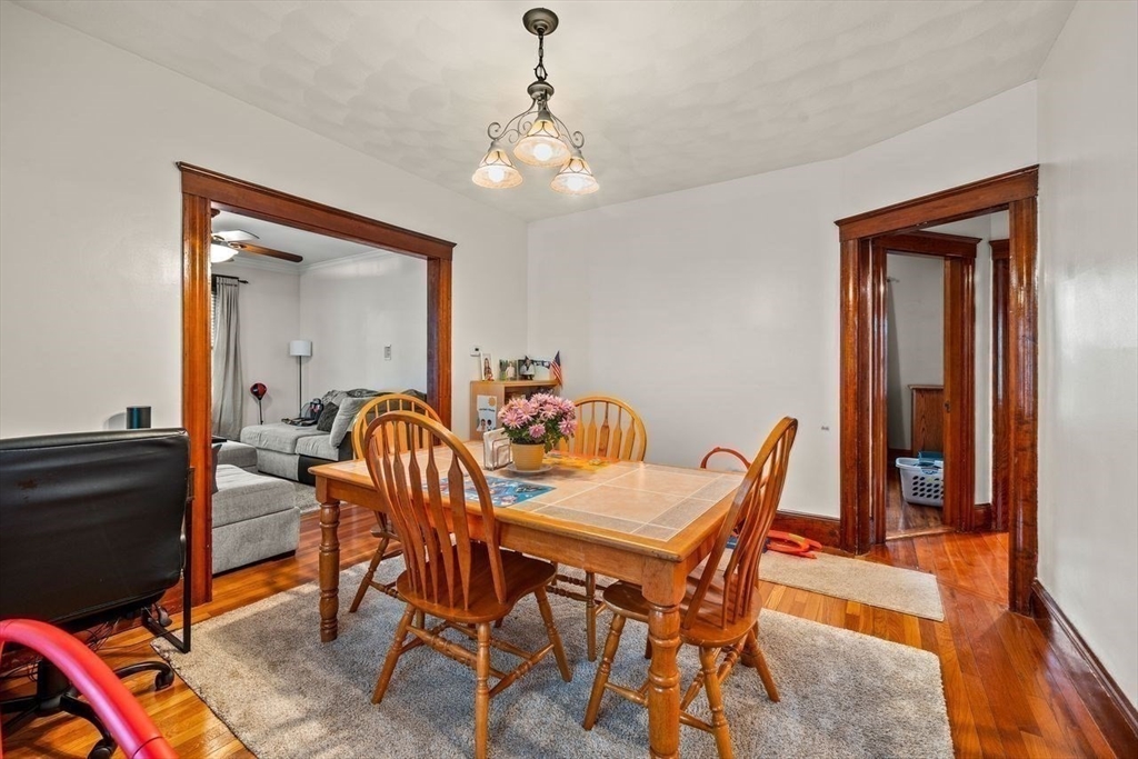 86-88 Maple Avenue North Andover, MA 01845 - Photo 24 of 41 a dining room with furniture and wooden floor
