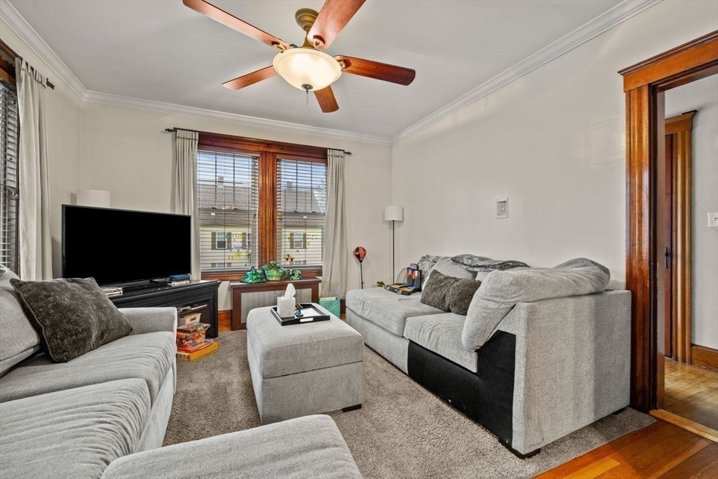 86-88 Maple Avenue North Andover, MA 01845 - Photo 25 of 41 a living room with furniture and a flat screen tv