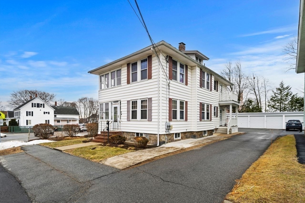 86-88 Maple Avenue North Andover, MA 01845 - Photo 3 of 41 a front view of a house with a yard