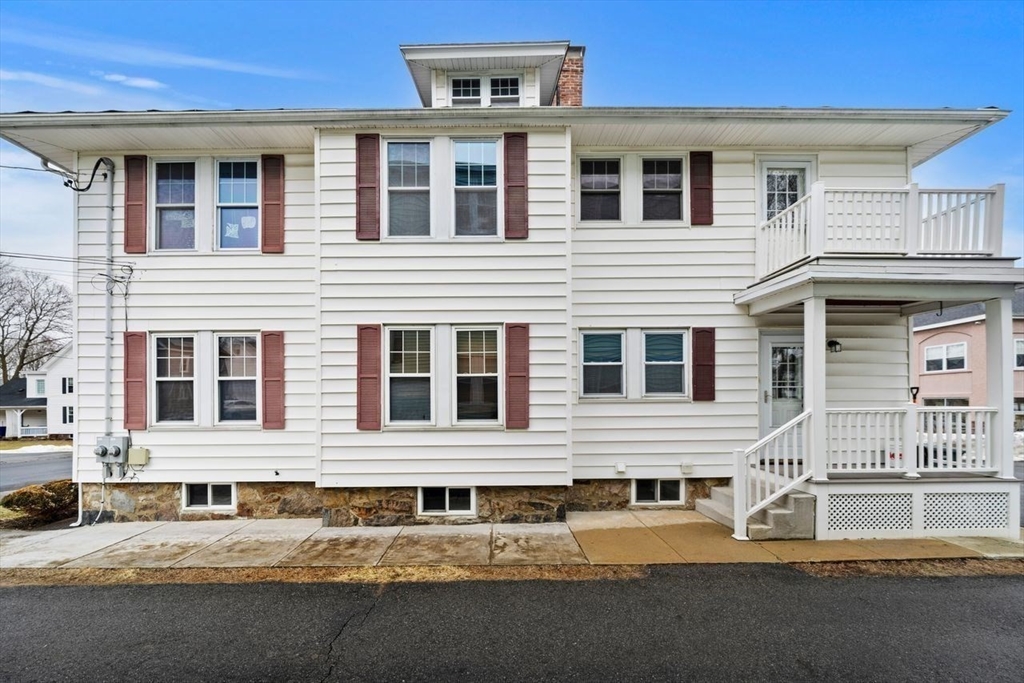 86-88 Maple Avenue North Andover, MA 01845 - Photo 4 of 41 a front view of a house with a yard