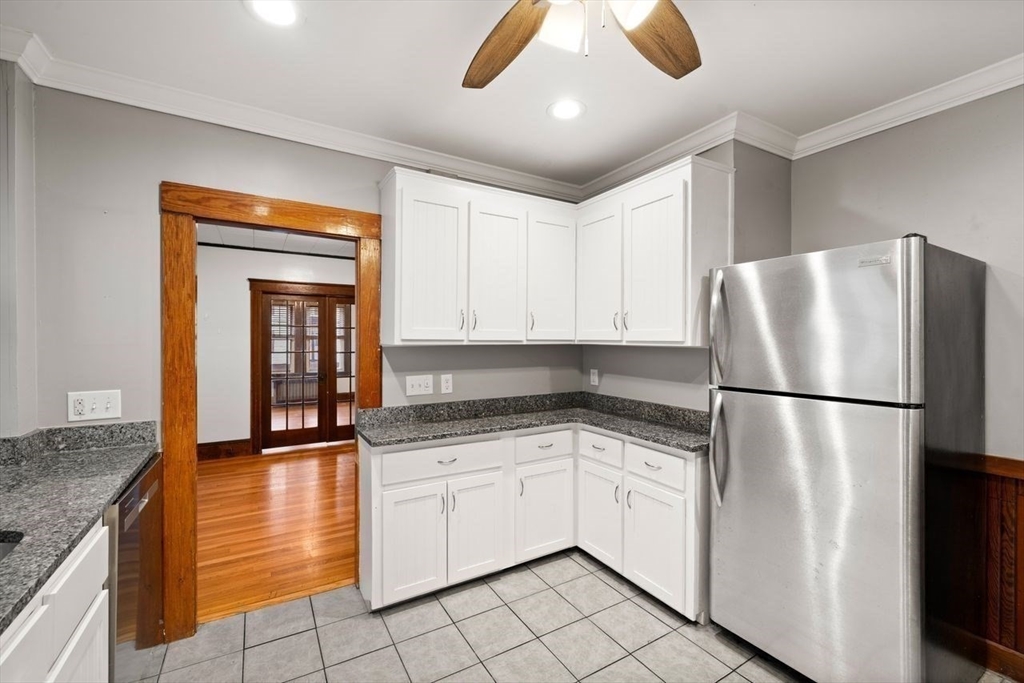 86-88 Maple Avenue North Andover, MA 01845 - Photo 10 of 41 a white refrigerator freezer sitting inside of a kitchen