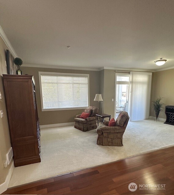 23943 Northeast 115th Lane, Unit 204 Redmond, WA 98053 - Photo 6 of 24 a living room with furniture window and a wooden floor