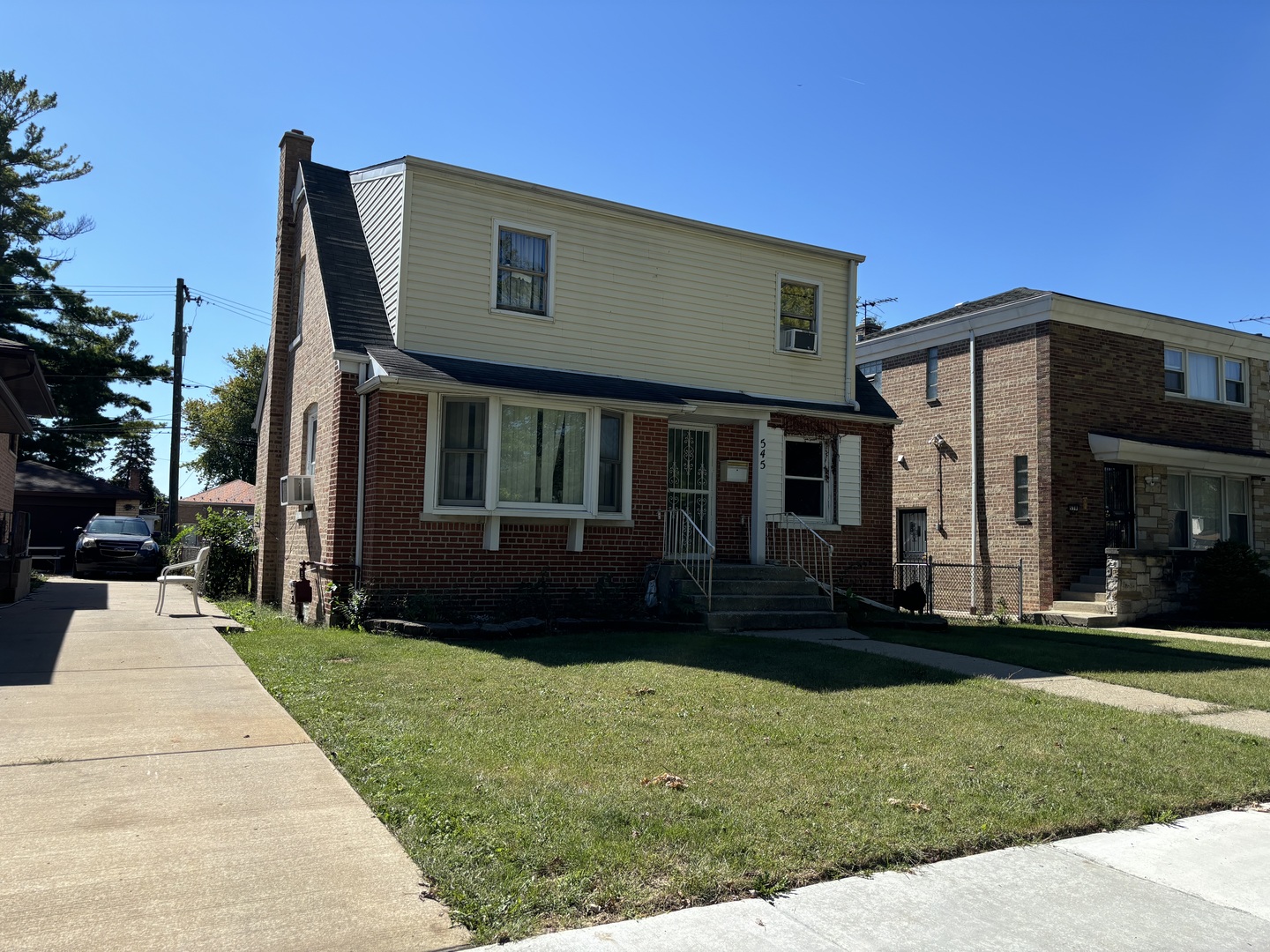 545 East 86th Street Chicago, IL 60619 - Photo 1 of 22 a front view of a house with a yard