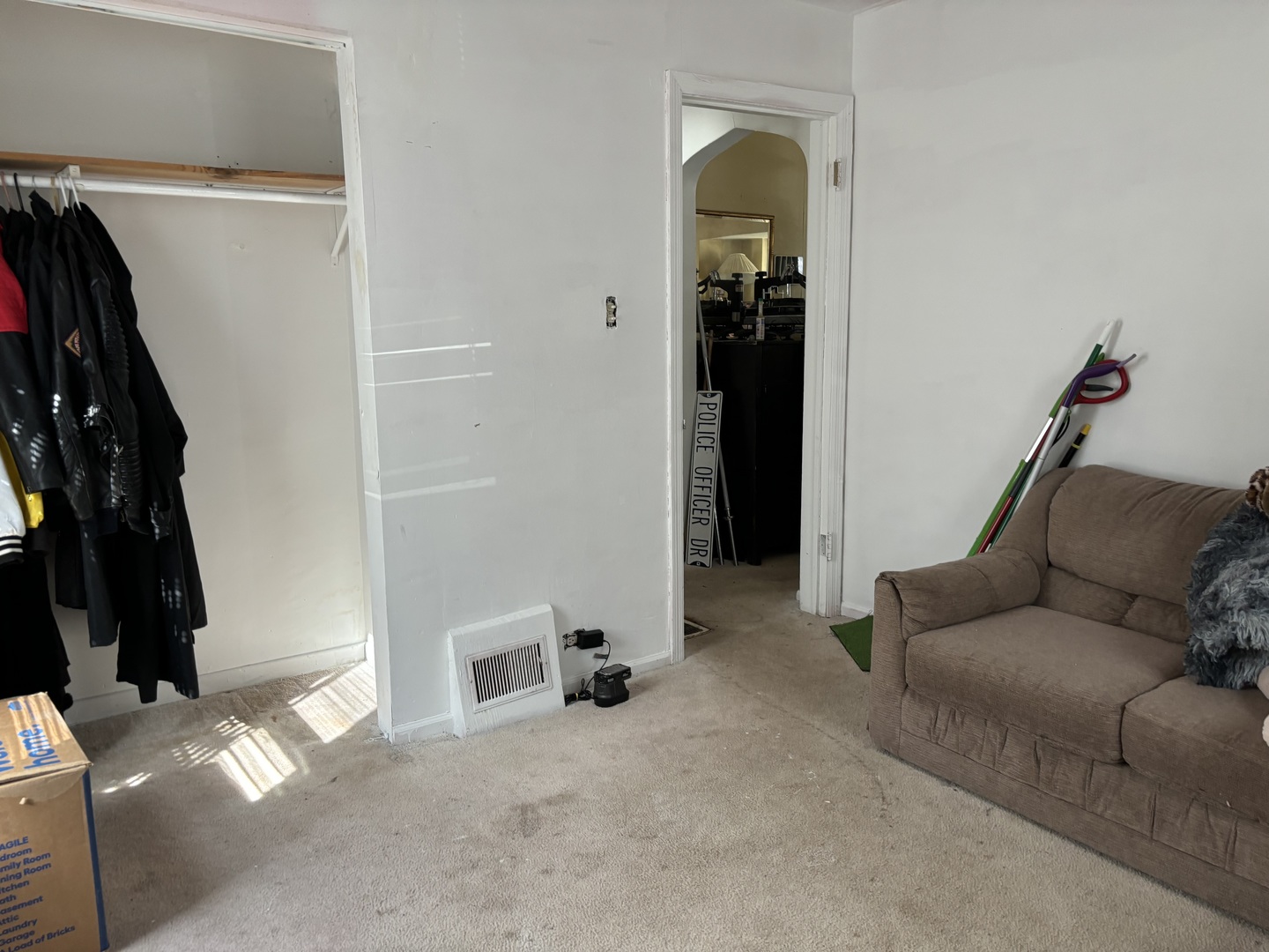 545 East 86th Street Chicago, IL 60619 - Photo 15 of 22 a living room with furniture and a walk in closet