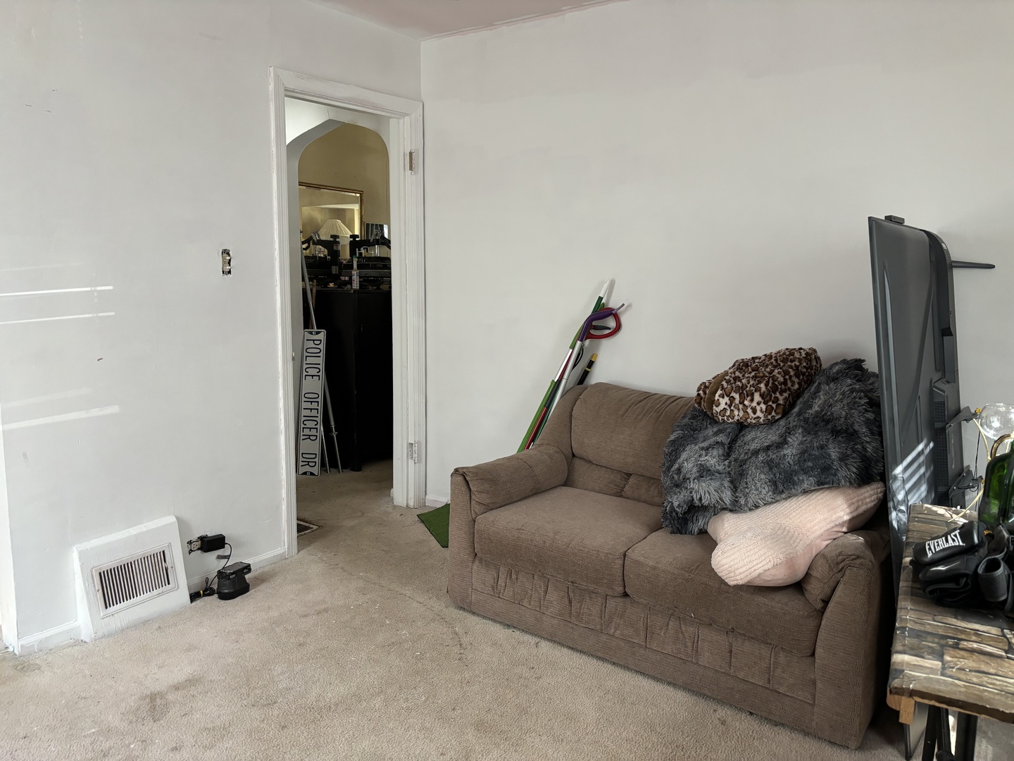 545 East 86th Street Chicago, IL 60619 - Photo 16 of 22 a living room with furniture and a flat screen tv