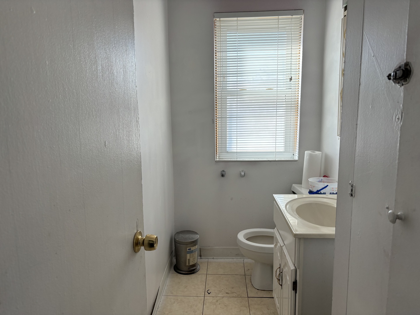 545 East 86th Street Chicago, IL 60619 - Photo 17 of 22 a bathroom with a sink toilet and a mirror