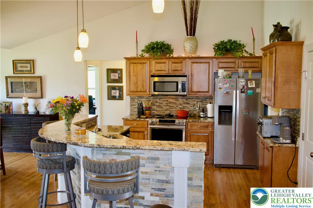 101 Cider Mill Road Mertztown, PA 19539 - Photo 5 of 26 a kitchen with a refrigerator and a stove