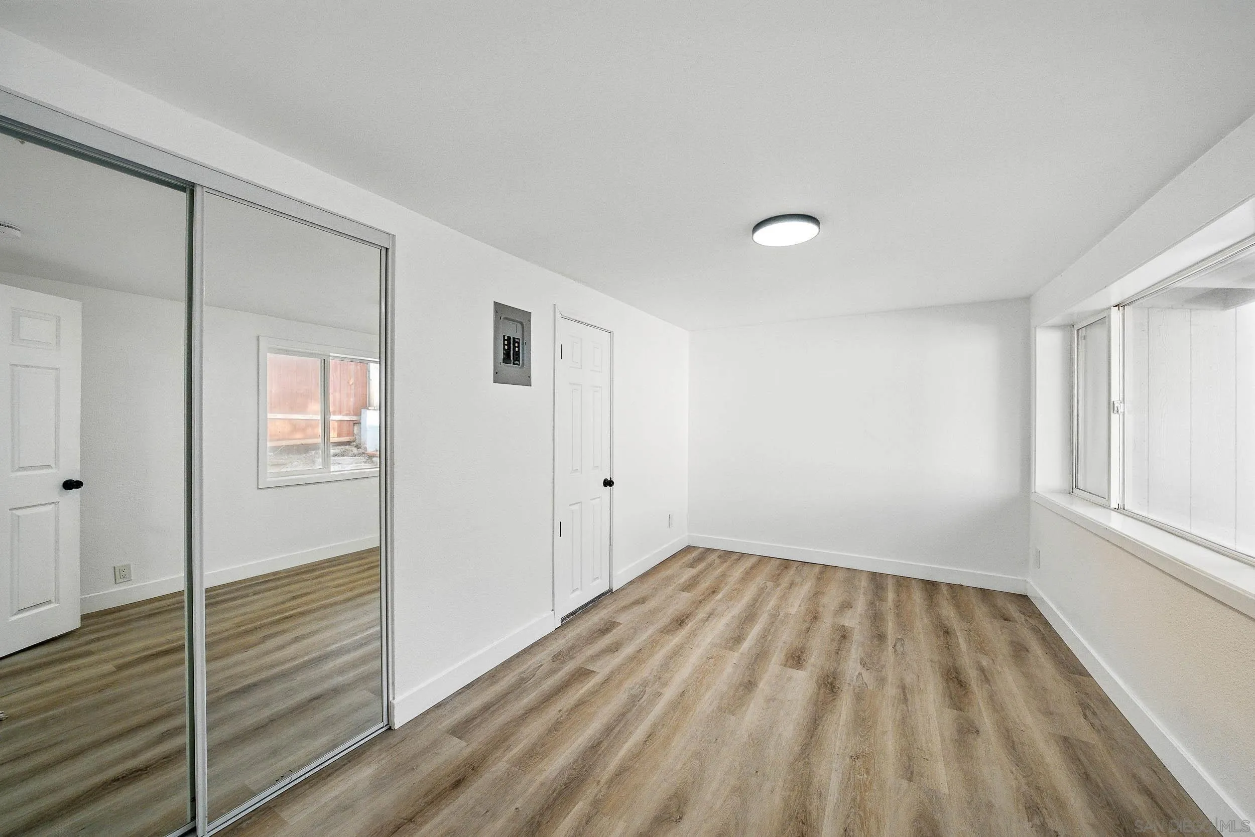 12049 Coping Place Lakeside, CA 92040 - Photo 12 of 36 a view of a room with wooden floor and window