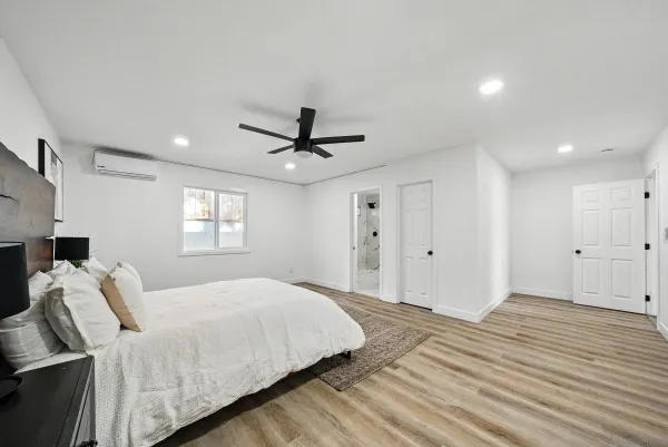 a bedroom with a bed and a window