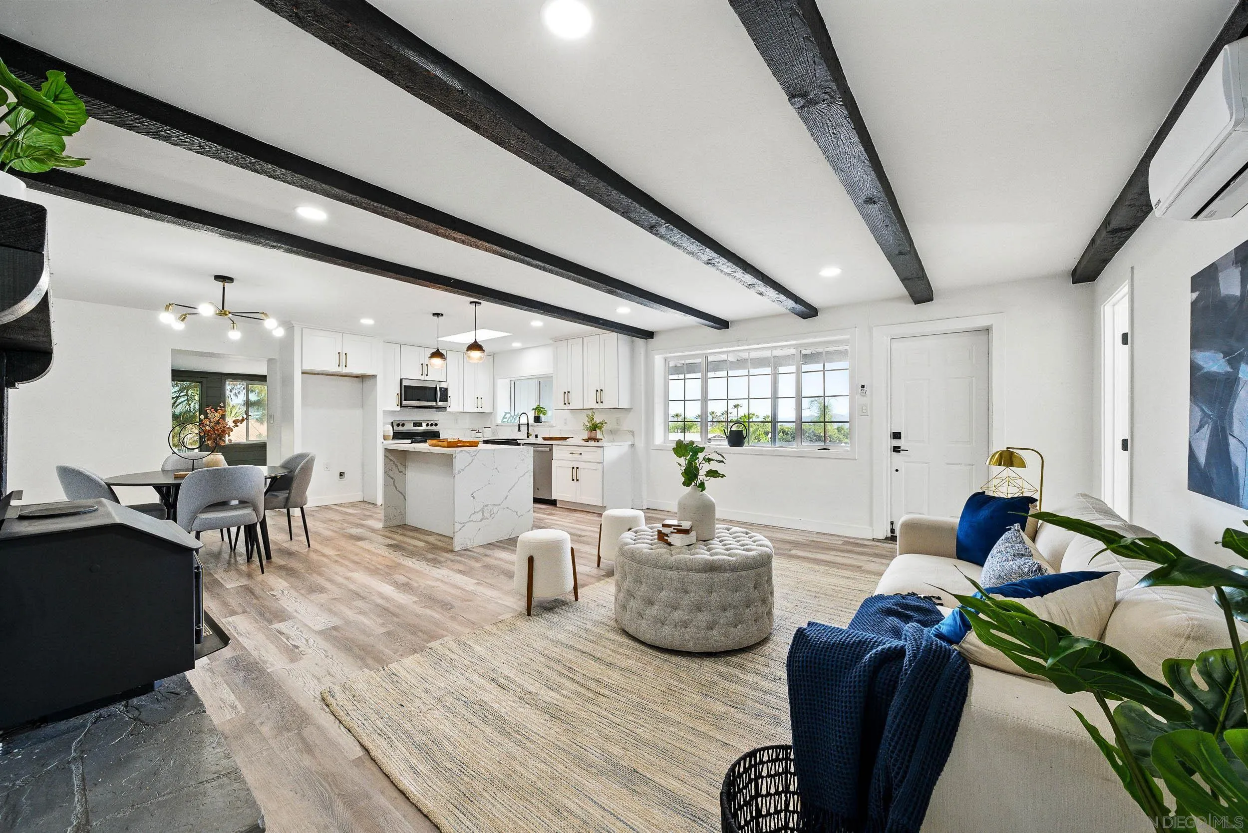 12049 Coping Place Lakeside, CA 92040 - Photo 2 of 36 a living room with furniture kitchen view and a chandelier