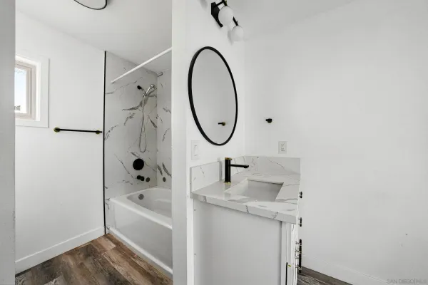 a bathroom with a sink and a mirror