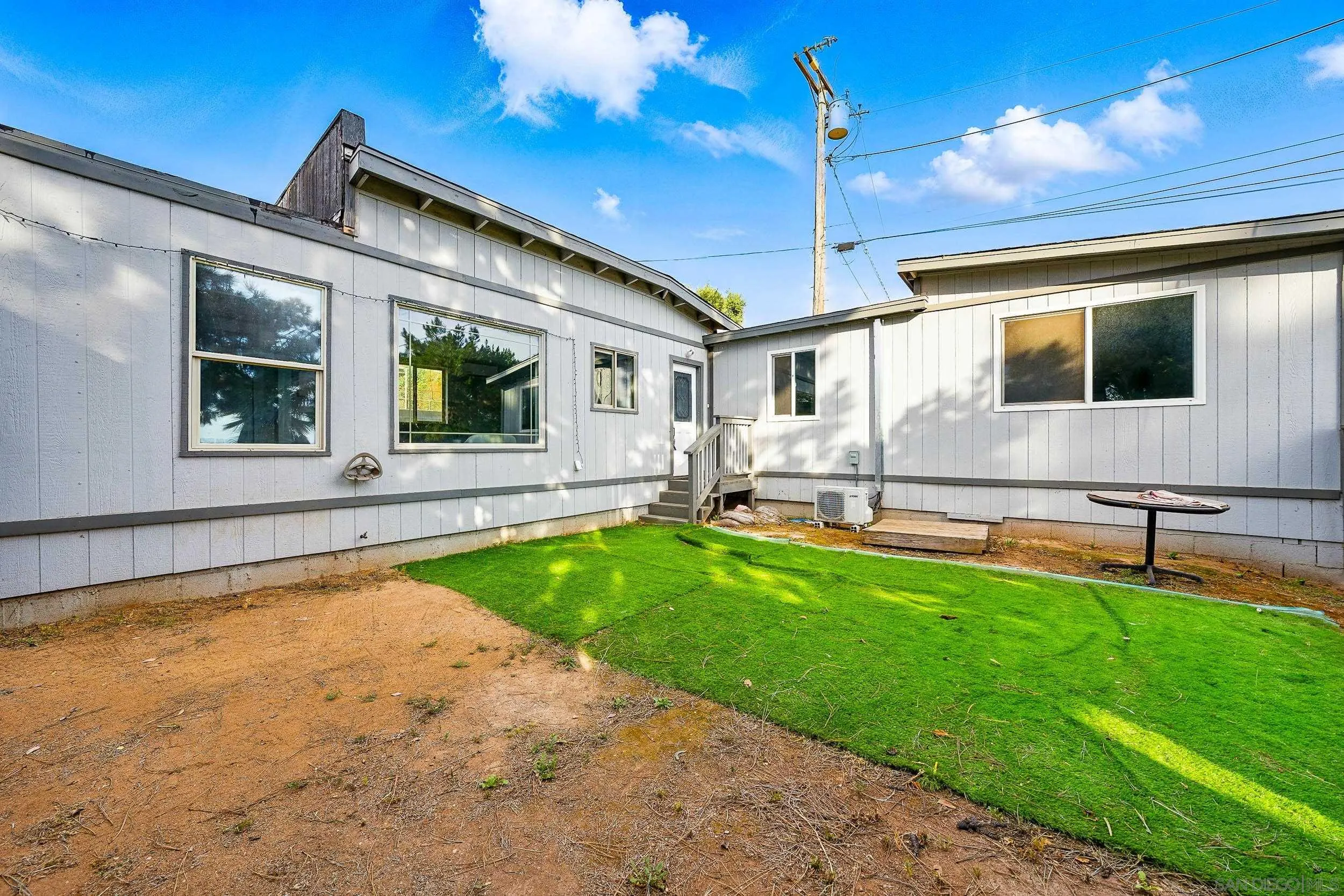 12049 Coping Place Lakeside, CA 92040 - Photo 28 of 36 a view of house with swimming pool outdoor seating