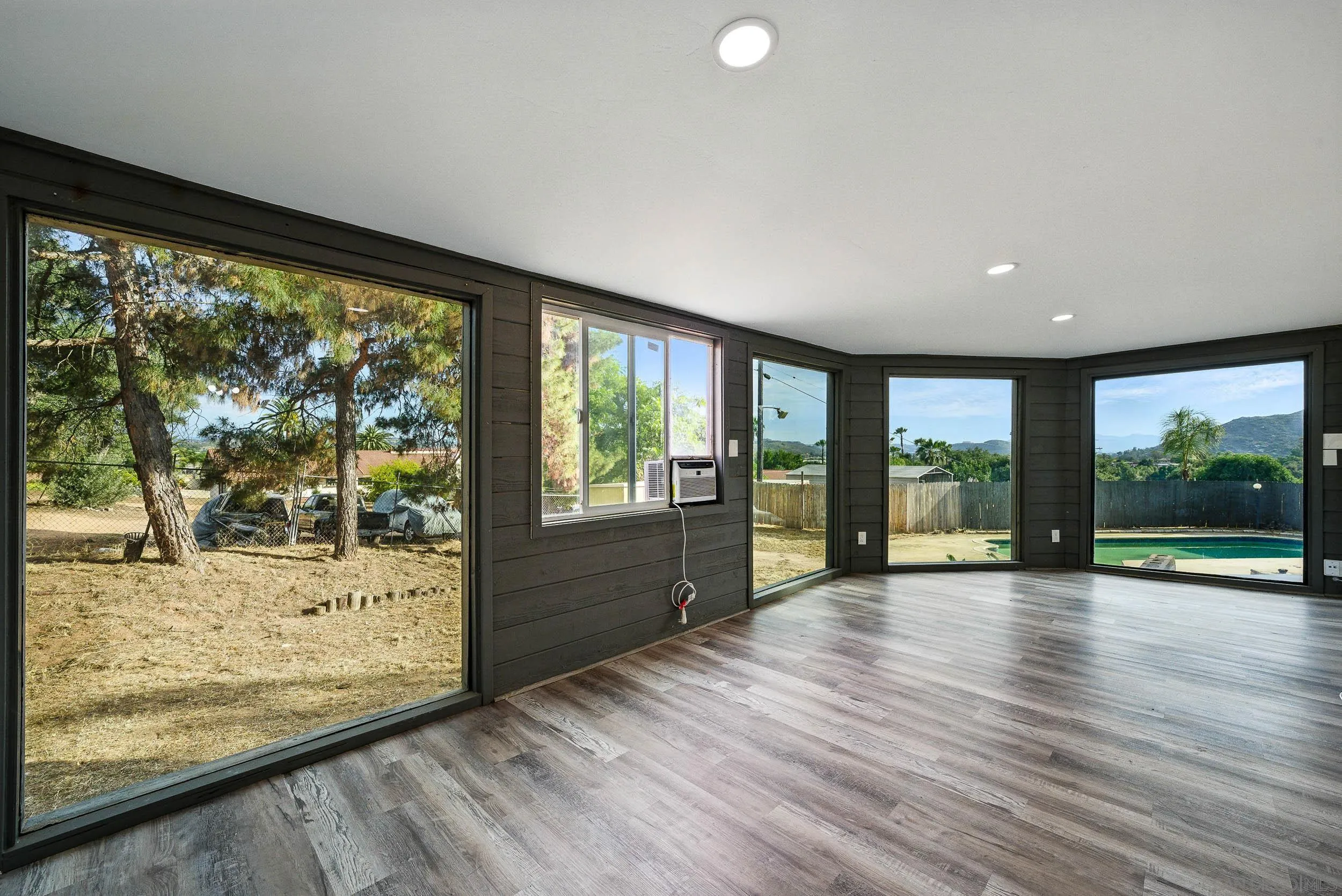 12049 Coping Place Lakeside, CA 92040 - Photo 5 of 36 a view of room with window and wooden floor