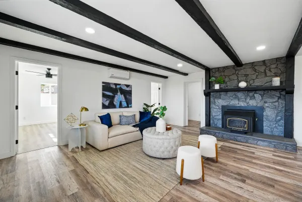a living room with furniture and a fireplace