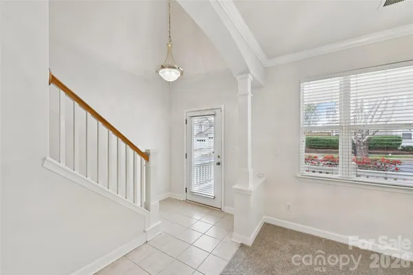 a view of an entryway with wooden floor