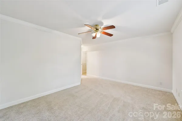 a spacious bathroom with a double vanity sink a mirror and a bathtub