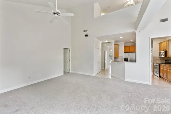 an empty room with a bathroom and a sink