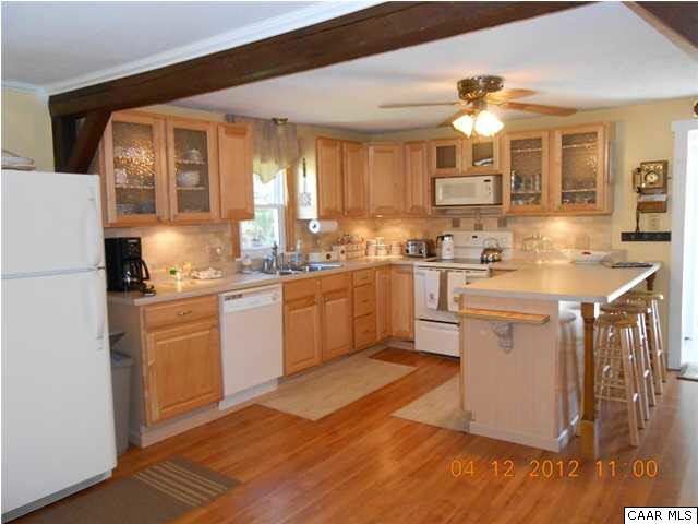 1714 Boxwood Farm Road Amherst, VA 24521 - Photo 4 of 10 a kitchen with a sink cabinets and window