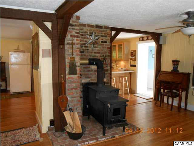 1714 Boxwood Farm Road Amherst, VA 24521 - Photo 5 of 10 a living room with furniture a fireplace and a table