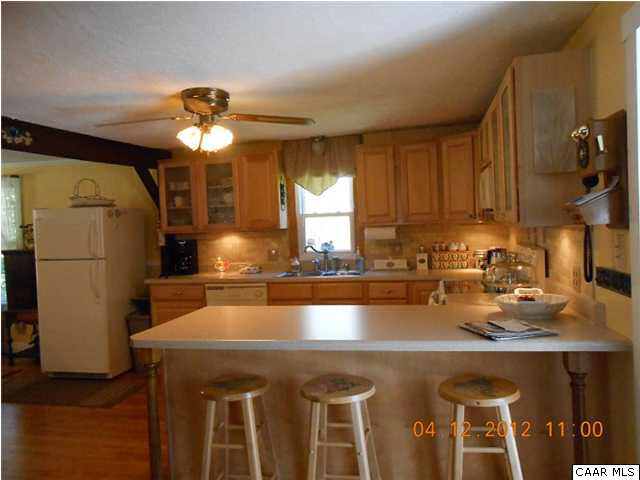 1714 Boxwood Farm Road Amherst, VA 24521 - Photo 6 of 10 a kitchen with a sink a counter space cabinets and stainless steel appliances