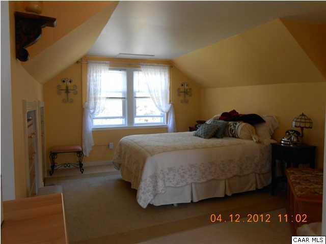1714 Boxwood Farm Road Amherst, VA 24521 - Photo 8 of 10 a bedroom with a bed and window