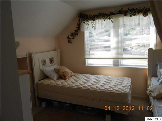 1714 Boxwood Farm Road Amherst, VA 24521 - Photo 9 of 10 a bedroom with a bed and a window