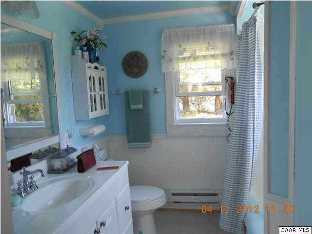 1714 Boxwood Farm Road Amherst, VA 24521 - Photo 10 of 10 a bathroom with a sink a toilet and a window