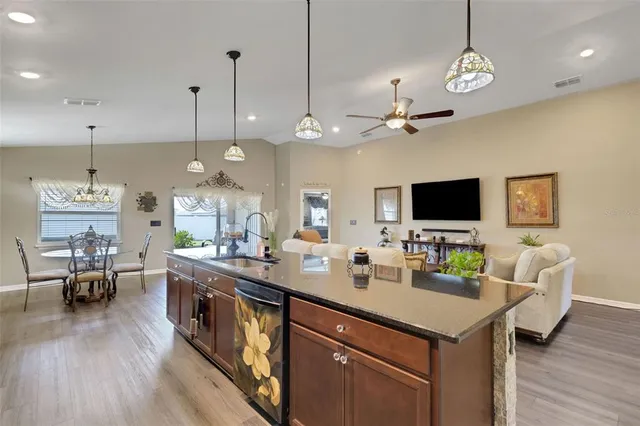 a large kitchen with a table and chairs