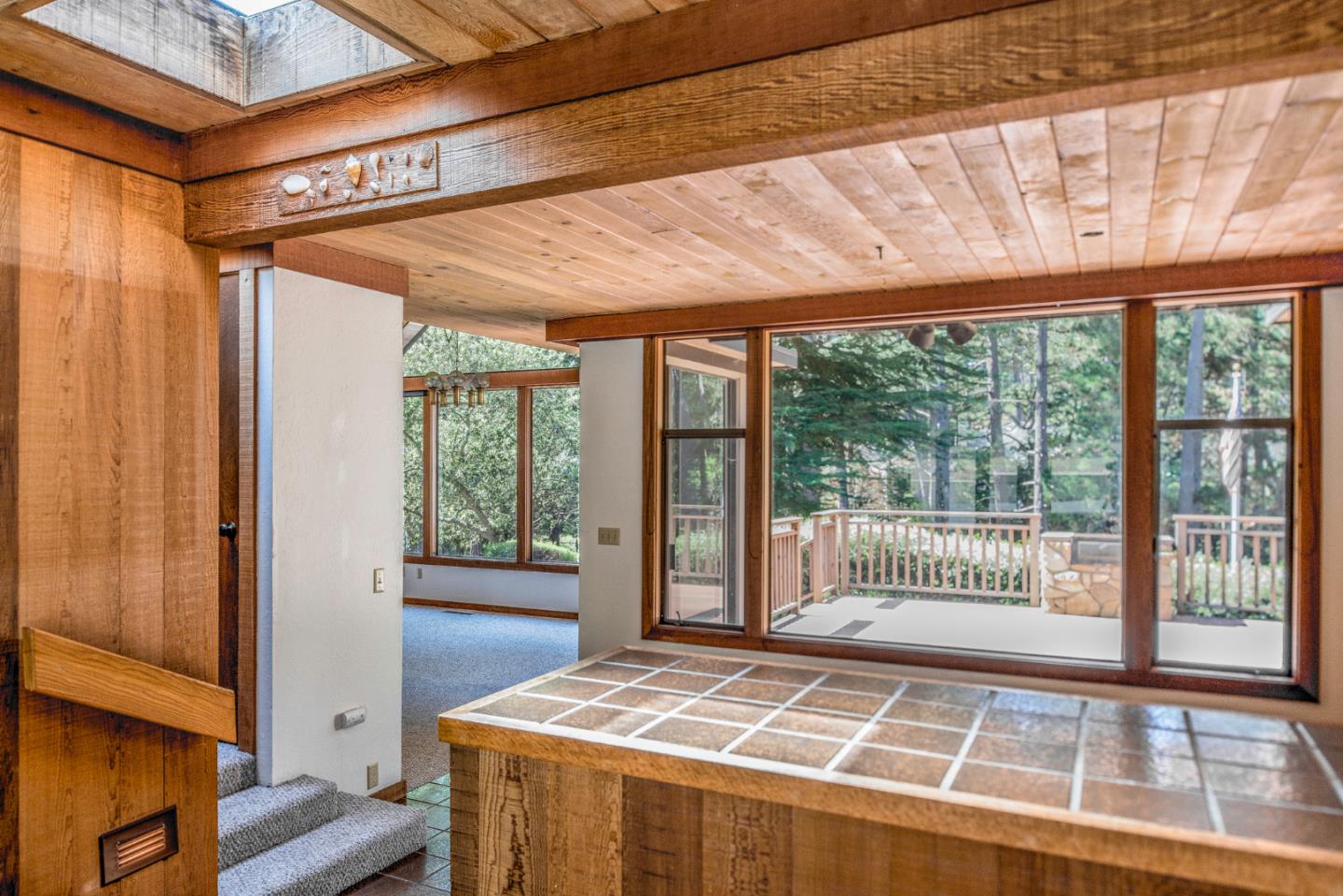 1280 Viscaino Road Pebble Beach, CA 93953 - Photo 12 of 48 a bedroom with a bed and wooden floor