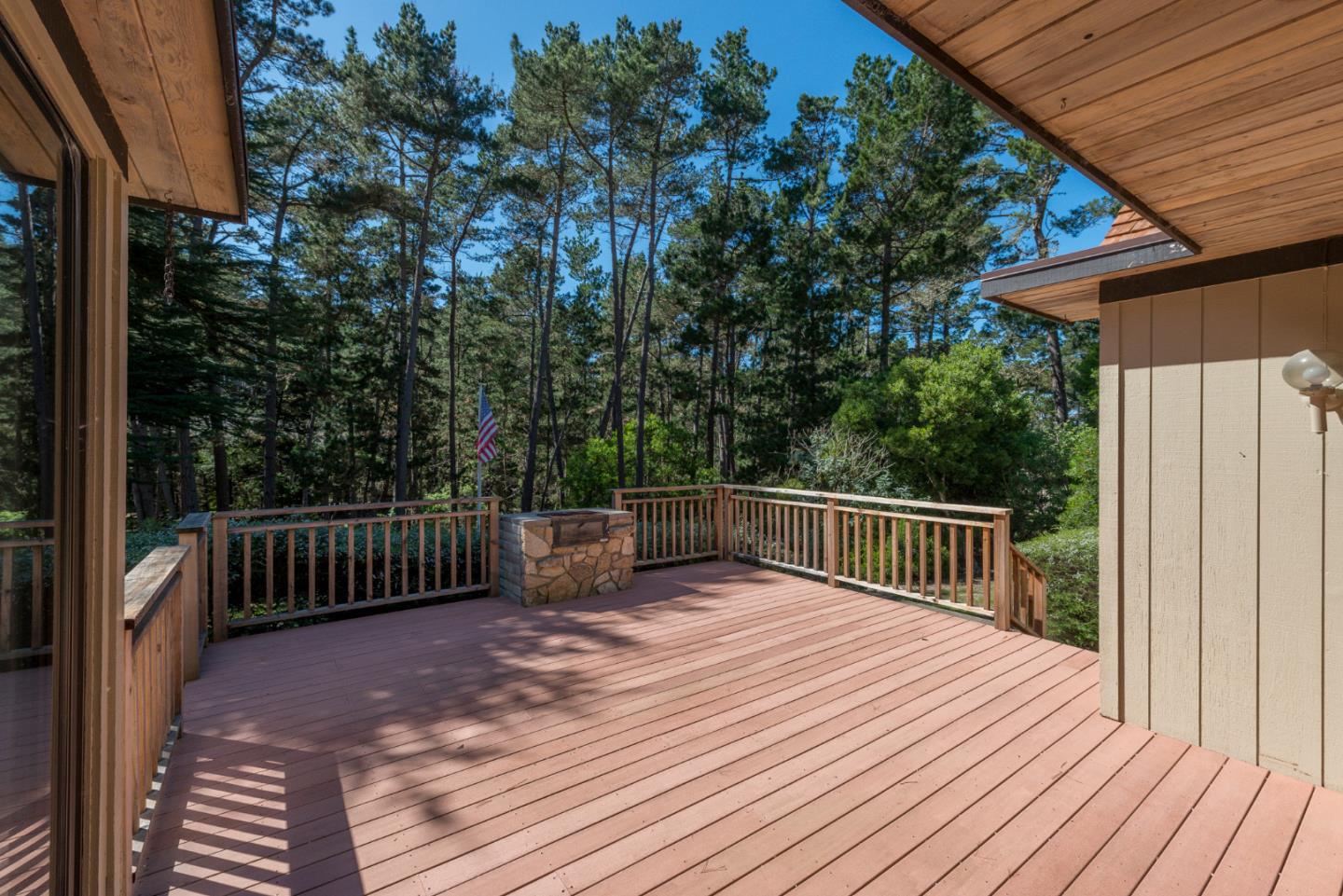1280 Viscaino Road Pebble Beach, CA 93953 - Photo 28 of 48 a balcony with wooden floor and yard in the back