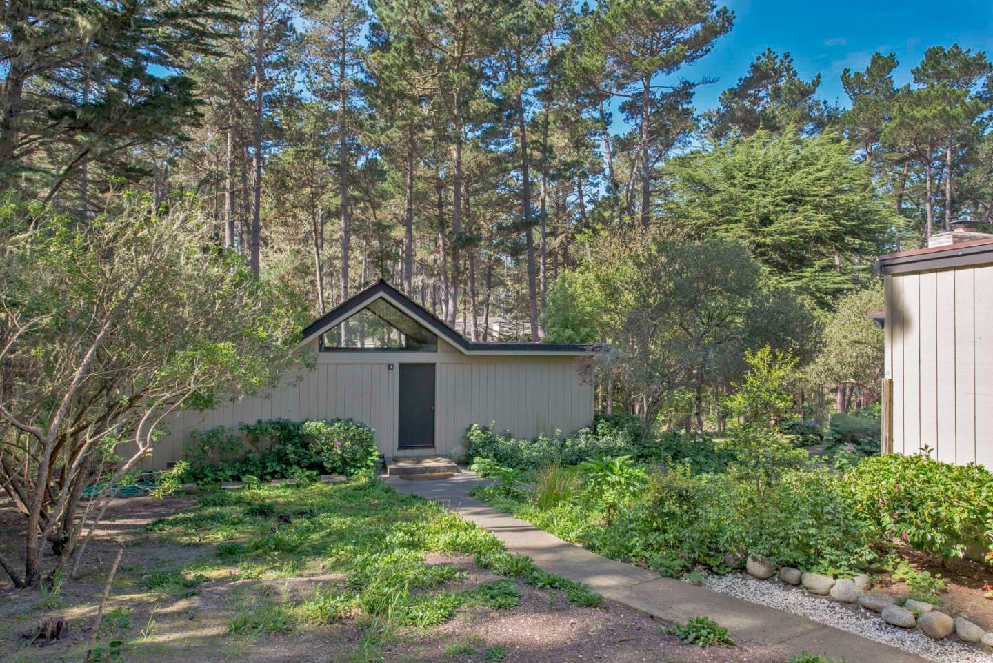 1280 Viscaino Road Pebble Beach, CA 93953 - Photo 29 of 48 a house that has a tree in front of it