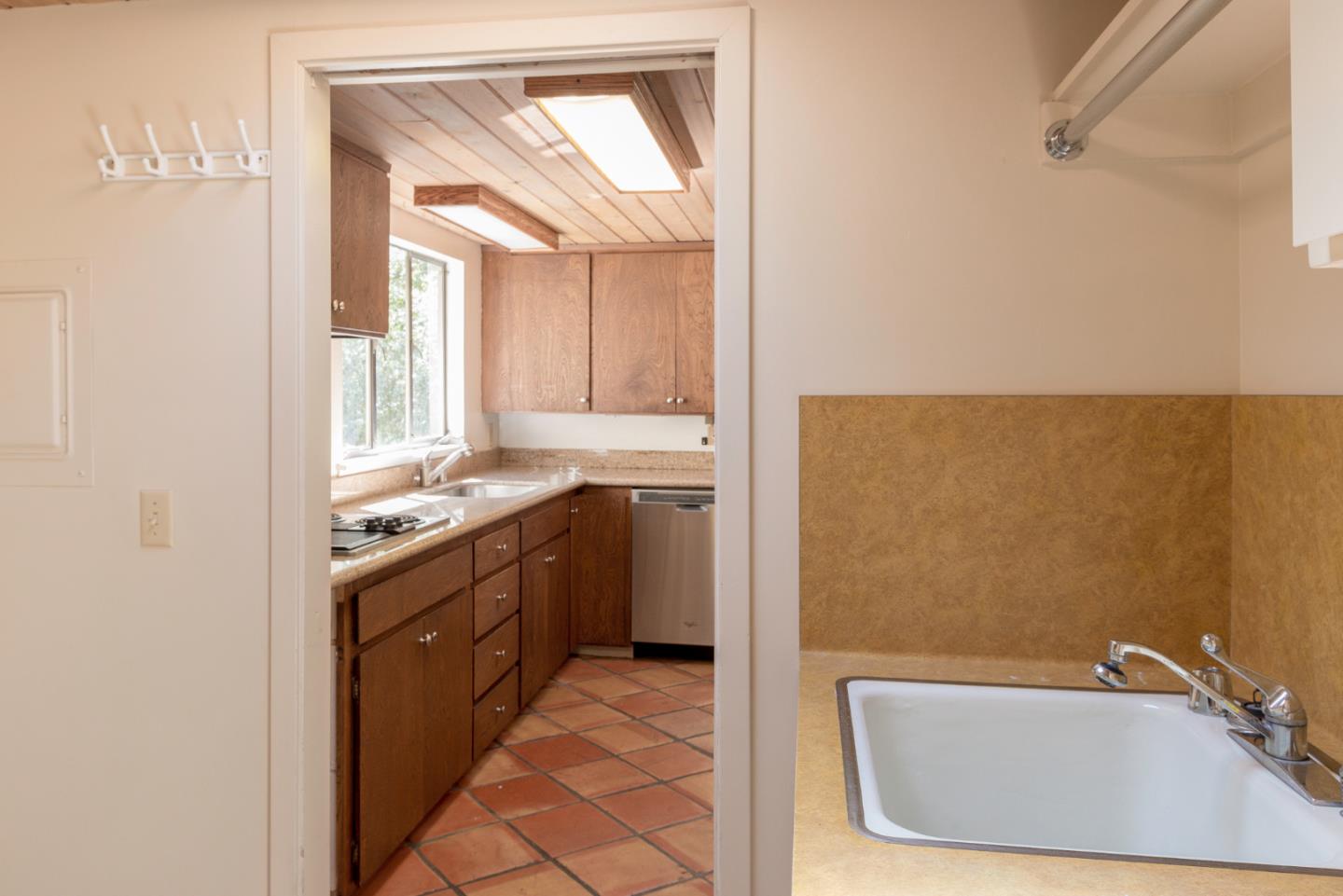 1280 Viscaino Road Pebble Beach, CA 93953 - Photo 37 of 48 a bathroom with a granite countertop sink and a bathtub