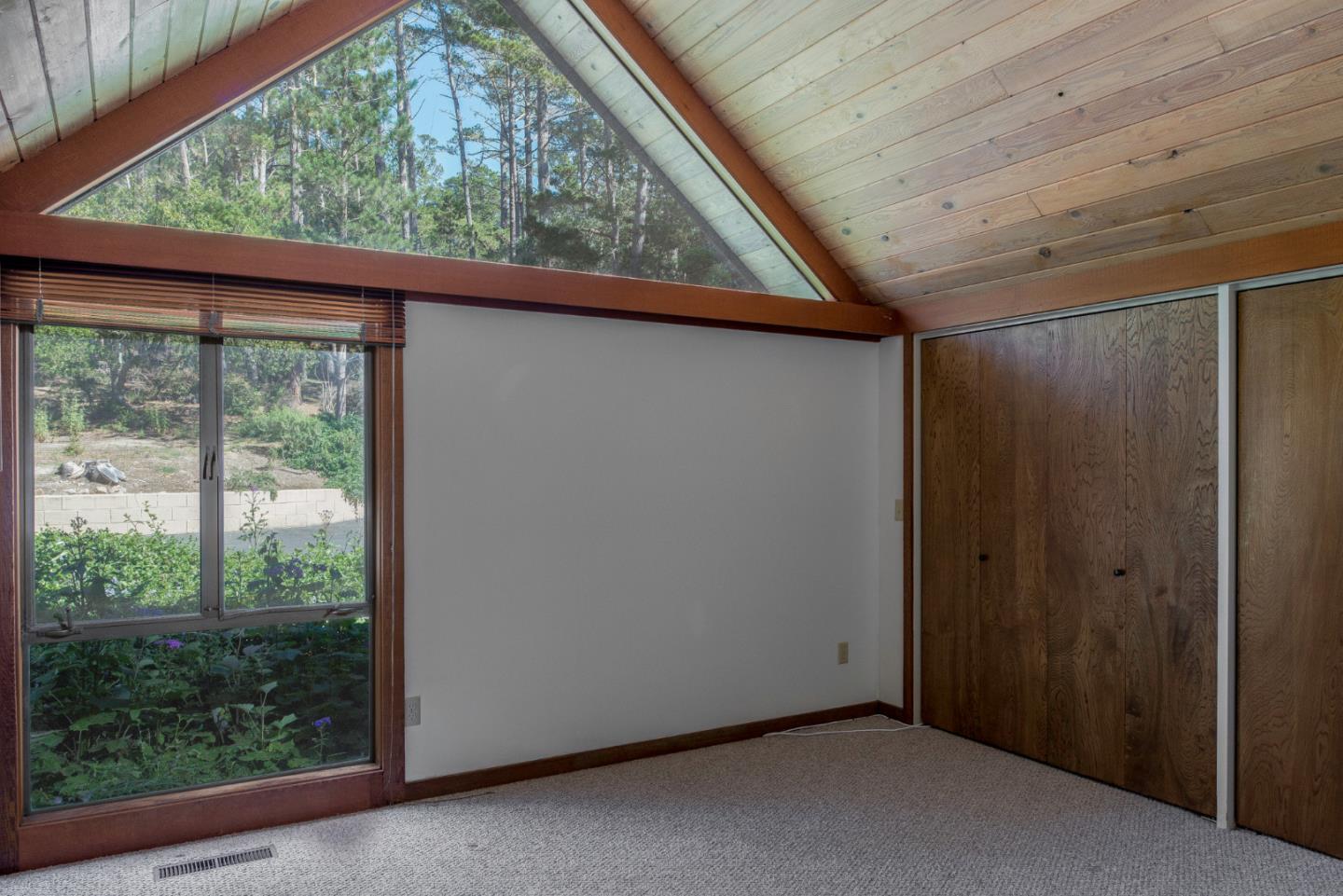 1280 Viscaino Road Pebble Beach, CA 93953 - Photo 40 of 48 a view of an empty room with a window