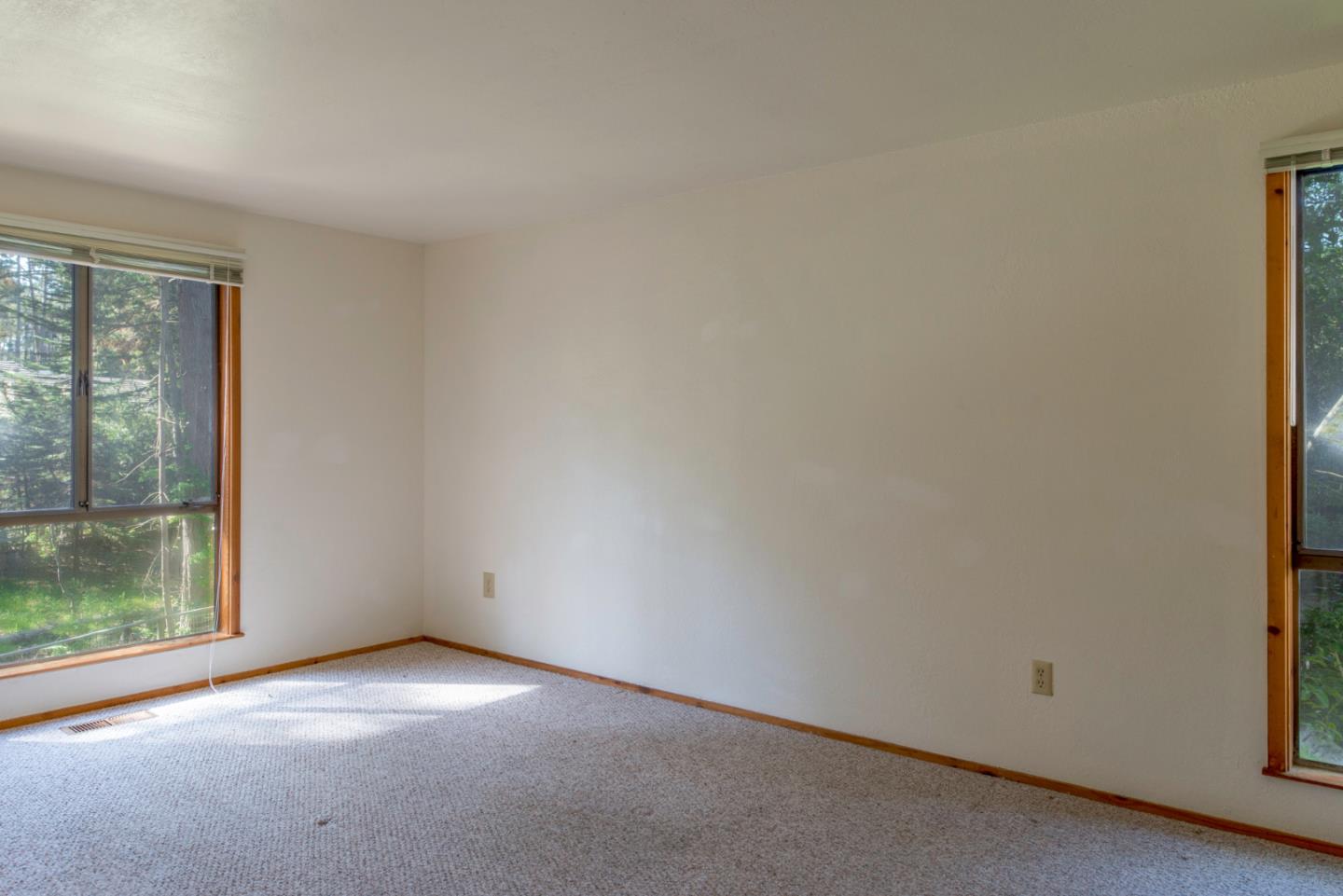 1280 Viscaino Road Pebble Beach, CA 93953 - Photo 45 of 48 an empty room with a window