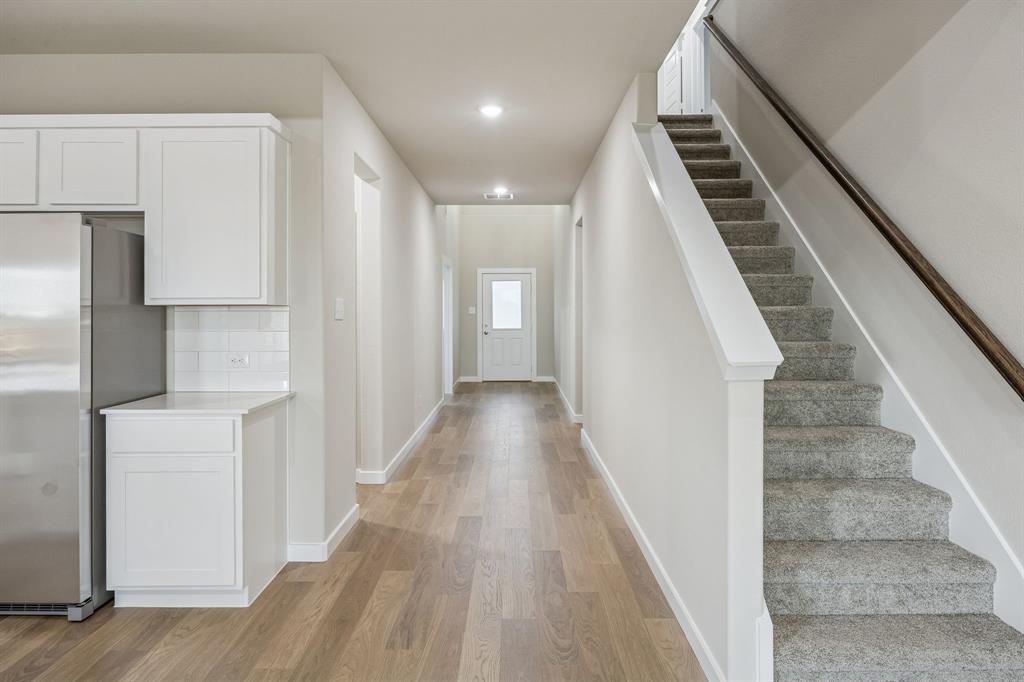 1404 Companero Street Haslet, TX 76052 - Photo 37 of 40 Entryway in the Wimbledon home plan by Trophy Signature Homes – REPRESENTATIVE PHOTO