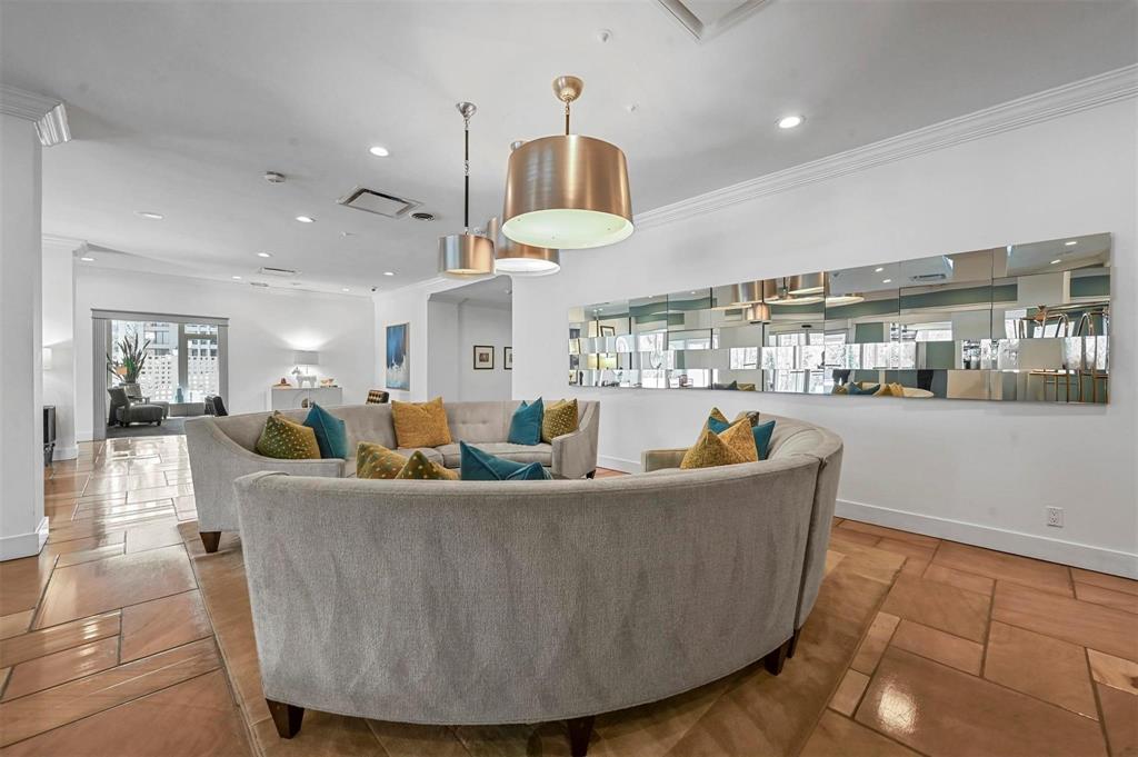 3883 Turtle Creek Boulevard, Unit 2015 Dallas, TX 75219 - Photo 24 of 31 Living room featuring recessed lighting and crown molding