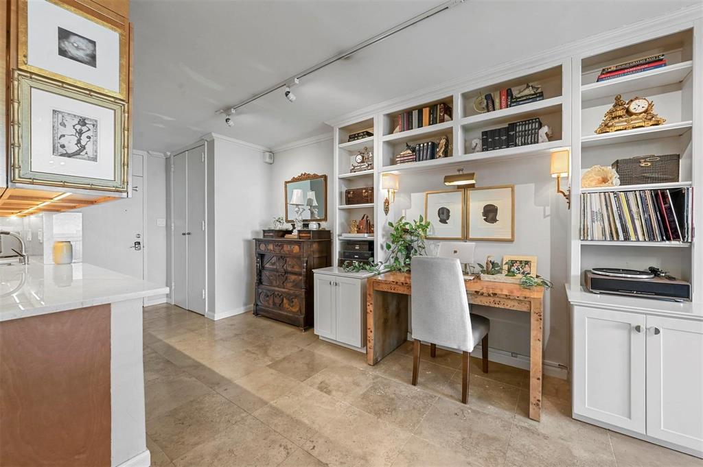 3883 Turtle Creek Boulevard, Unit 2015 Dallas, TX 75219 - Photo 5 of 31 built in office featuring track lighting, built in features, and crown molding
