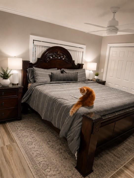 1623 Wavecrest Street Merritt Island, FL 32952 - Photo 10 of 26 a bedroom with a bed and a large mirror