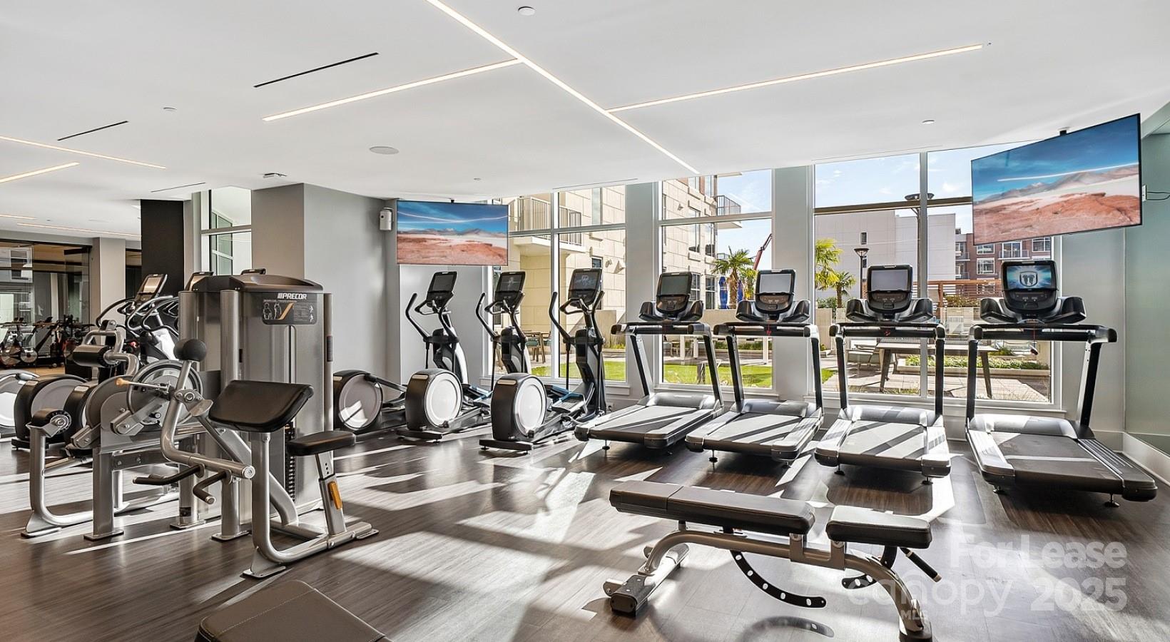 4425 Sharon Road, Unit 2F Charlotte, NC 28211 - Photo 12 of 44 a view of a room with gym equipment