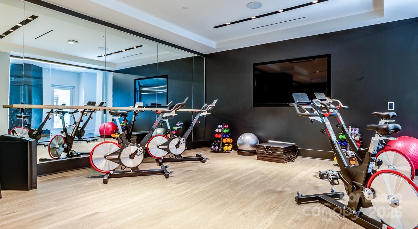 4425 Sharon Road, Unit 2F Charlotte, NC 28211 - Photo 14 of 44 a view of a room with gym equipment