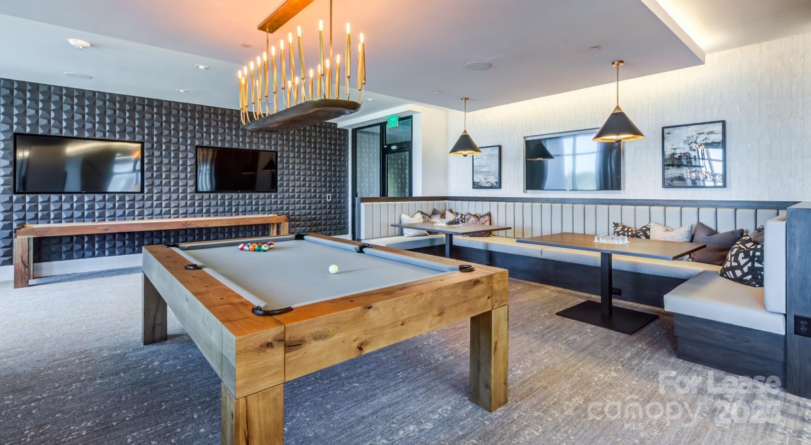 4425 Sharon Road, Unit 2F Charlotte, NC 28211 - Photo 8 of 44 a living room with furniture pool table chairs and a flat screen tv