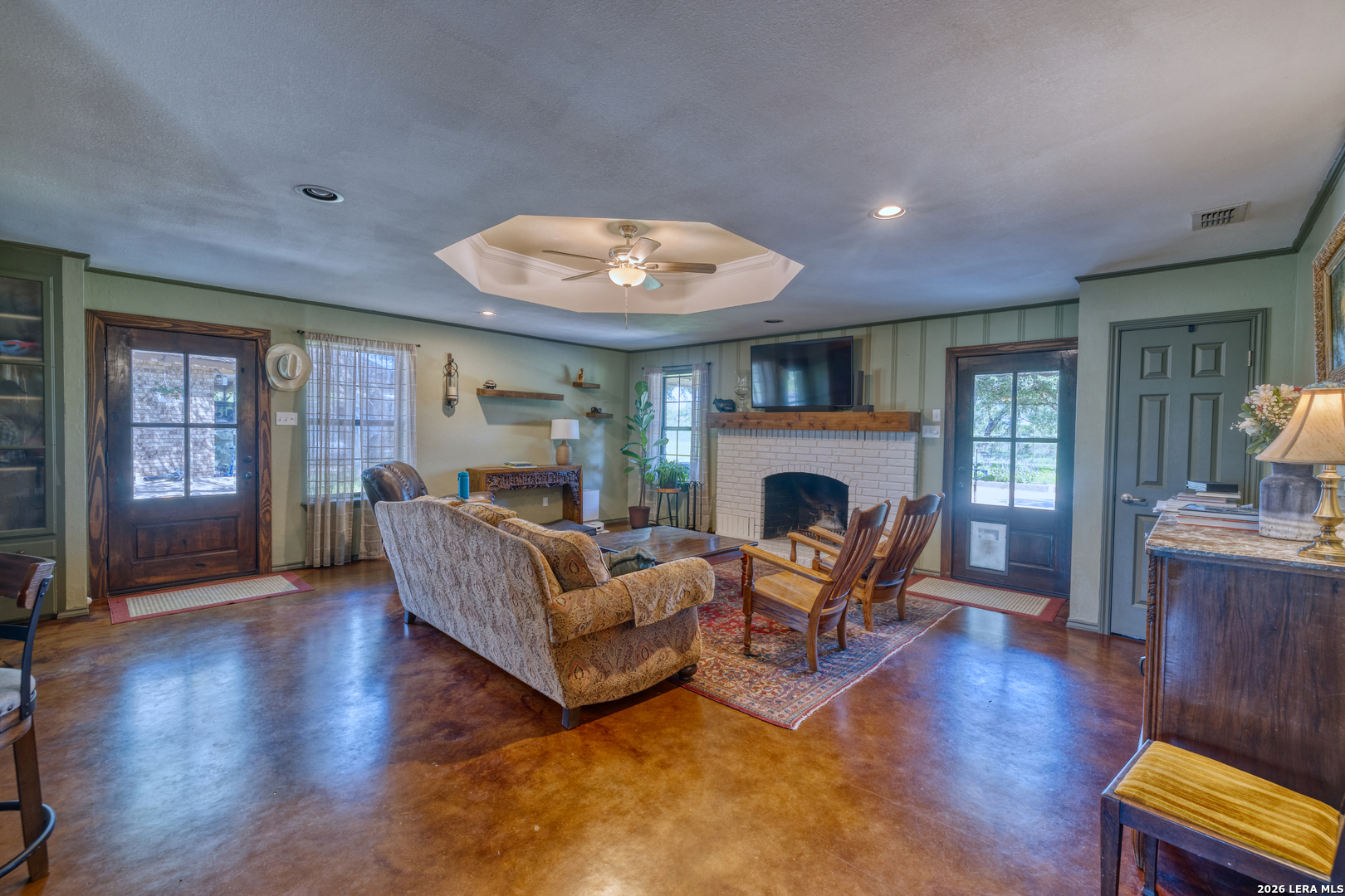 335 Sunset Ridge Road Uvalde, TX 78801 - Photo 7 of 8 a living room with furniture and a fireplace